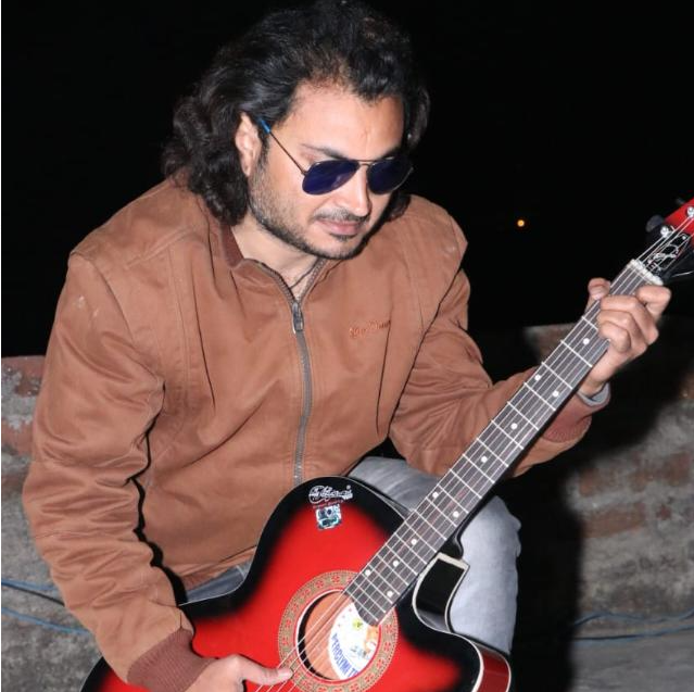 Pritam Pathak playing guitar